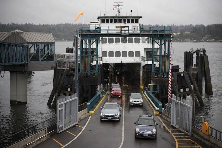 caption: Cars drive off of the Hyak ferry shortly after arriving in Bremerton, Washington, on Thursday, June 8, 2017. 