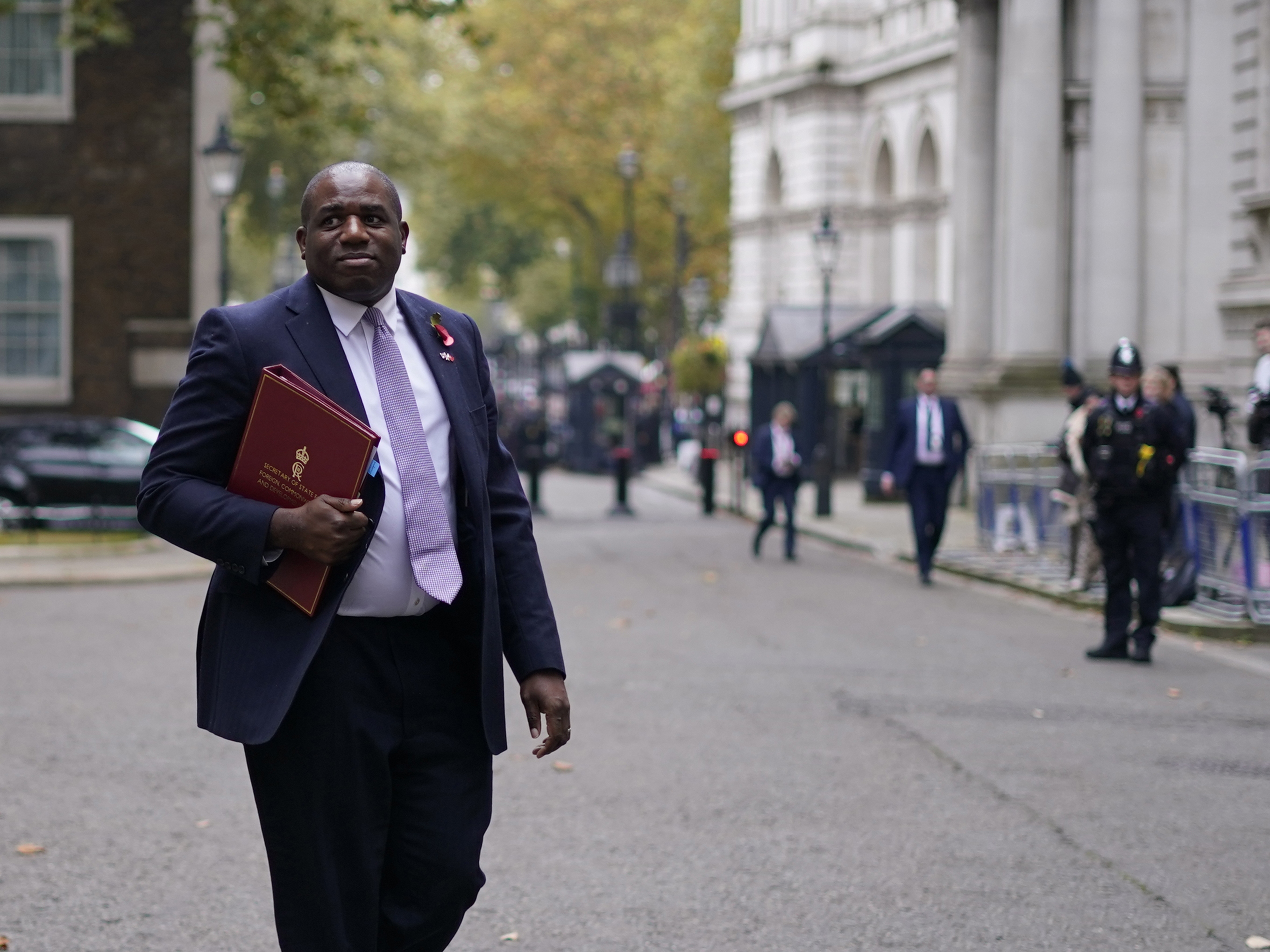 caption: Britain's Foreign Secretary David Lammy departs following a pre-Budget cabinet meeting in 10 Downing Street, London, Wednesday, Oct. 30, 2024.