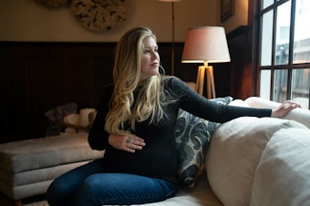 caption: Lauren Miller at her home in Dallas, Texas, in January 2023. When she was 15 weeks pregnant, she traveled to Colorado to have a "selective reduction" abortion, after one of her twins was diagnosed with a fatal condition.