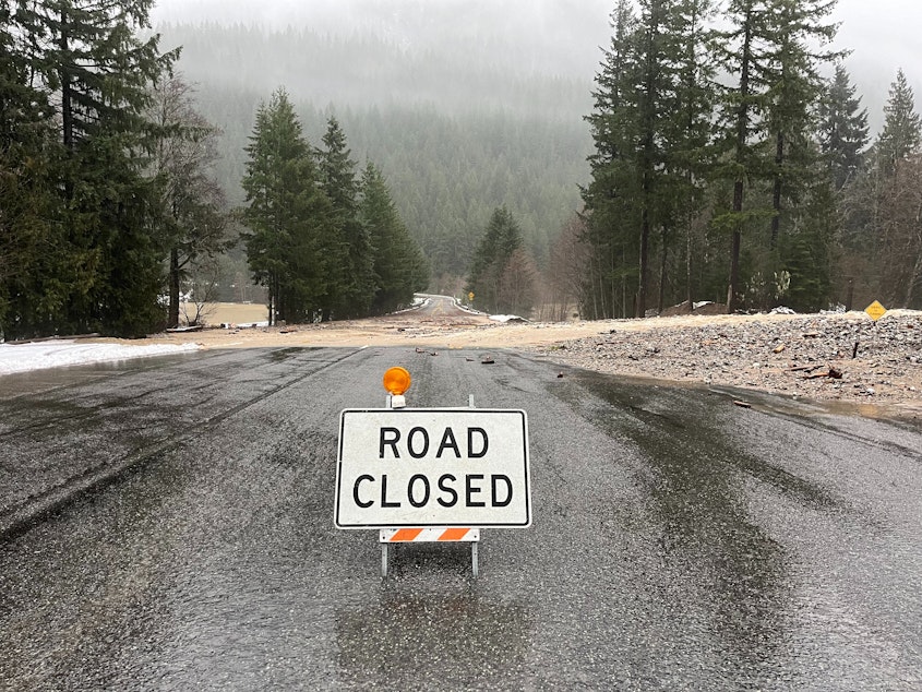 caption: State Route 20 near the south end of Diablo Late east of Newhalem was closed due Dec. 5, 2023, due to water and debris over the roadway.