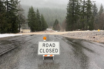 caption: State Route 20 near the south end of Diablo Late east of Newhalem was closed due Dec. 5, 2023, due to water and debris over the roadway.