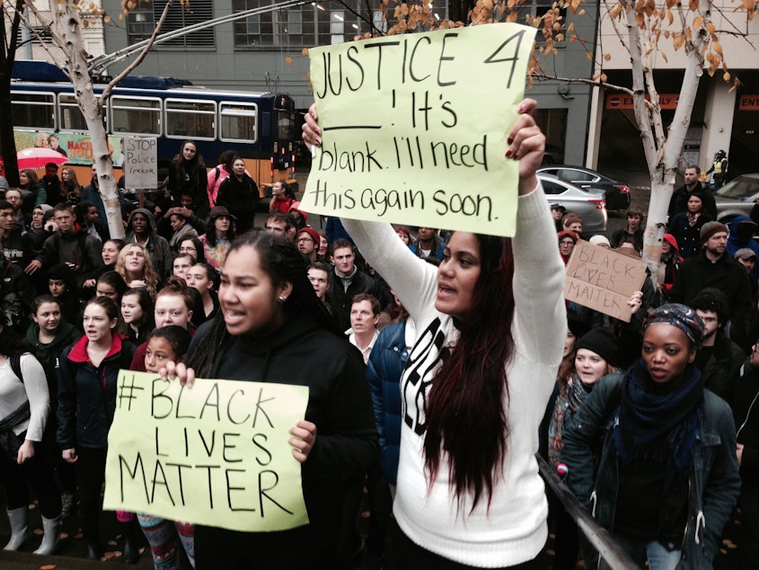 caption: Demonstrators at a Seattle march on Nov. 25, 2014, in response to the Ferguson grand jury decision.