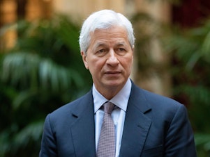 caption: Jamie Dimon, chief executive officer of JPMorgan Chase, has called for some workers to start returning to the office, fearing the impact of logging in from home for too long.