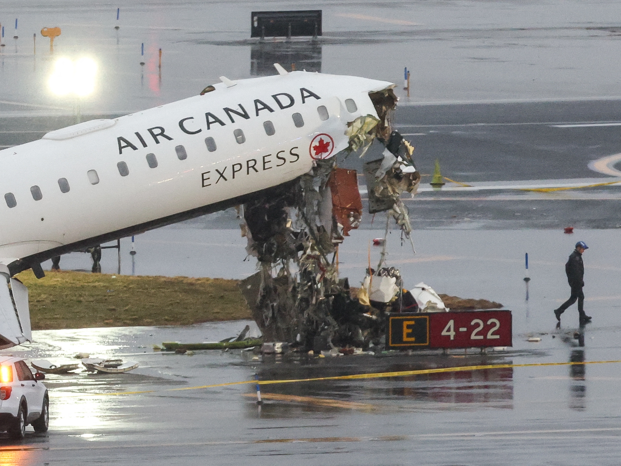 caption: The damaged Air Canada Express CRJ-900 sits on the LaGuardia runway Monday morning.