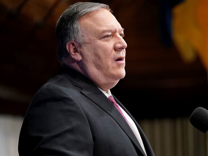 caption: Secretary of State Mike Pompeo speaks last week at the National Press Club in Washington. He said on Tuesday that China has committed genocide against its Muslim Uighur population.