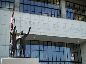 caption: The University of Alabama in Tuscaloosa makes up a sizeable portion of the city's population of roughly 100,000. Mayor Walt Maddox says losing an entire semester of school would be "economically disastrous for our community."