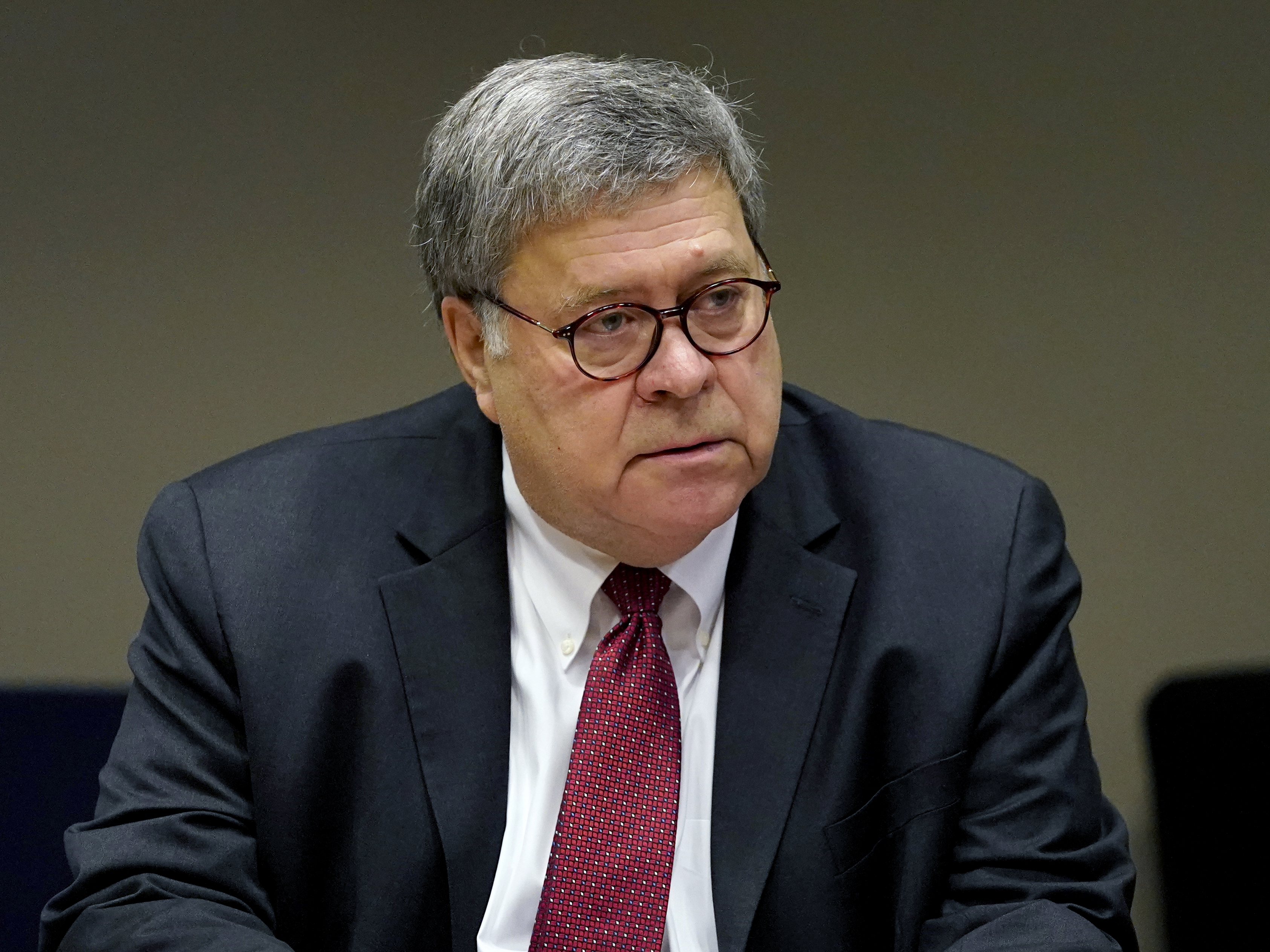 caption: U.S. Attorney General William Barr meets with members of the St. Louis Police Department on Oct. 15. On Monday night, Richard Pilger resigned as director of the Justice Department's election crimes branch, protesting Barr's memo authorizing federal prosecutors to pursue allegations of voting irregularities.