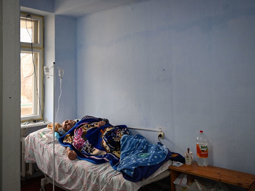 caption: A patient rests at the COVID ward of the regional hospital in Leova, Moldova, on March 23. Moldova remains one of the poorest countries in Europe and has relied on vaccine donations from Romania and COVAX, a program that aims to distribute the world's vaccines more equitably.