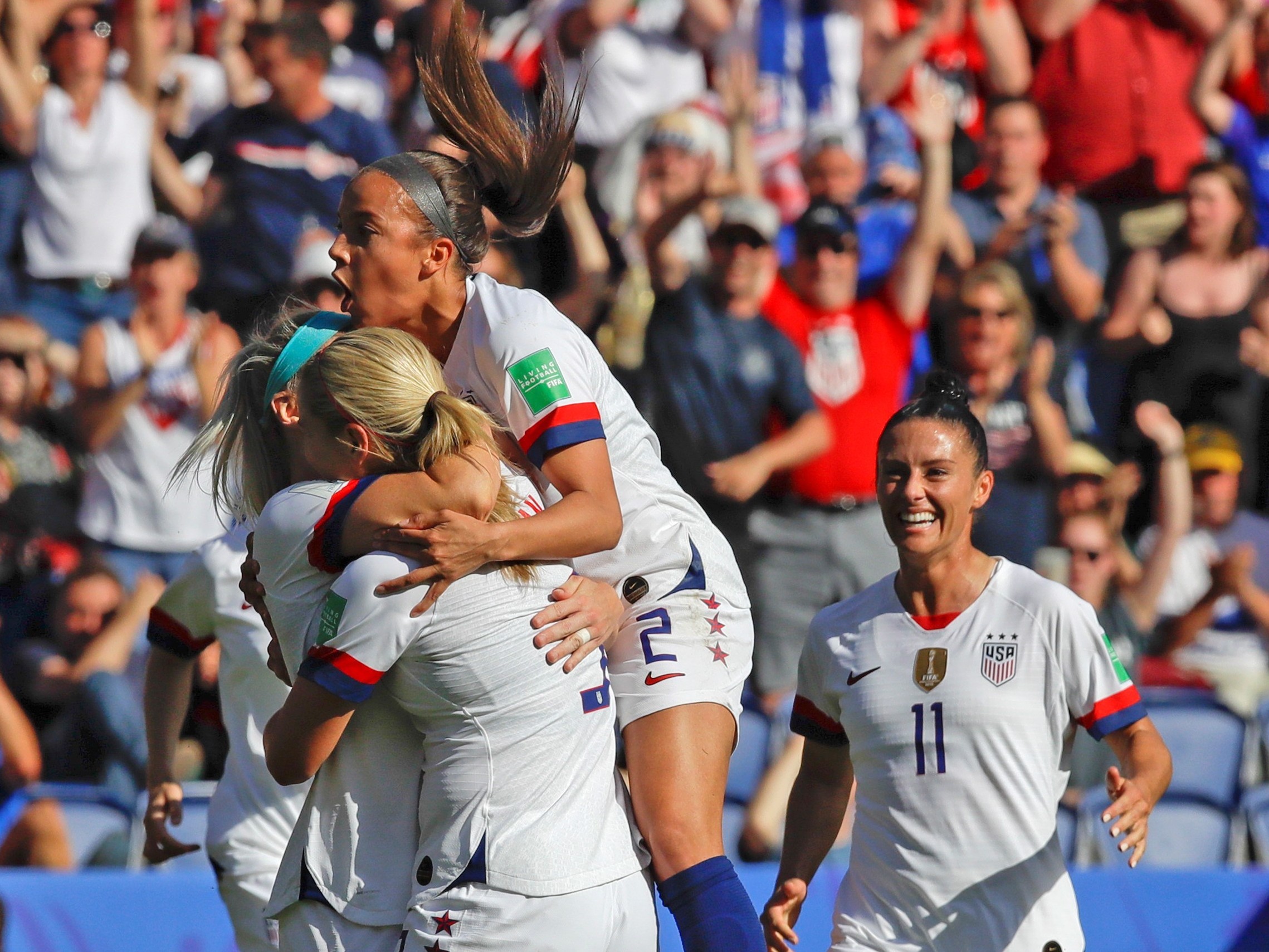caption: U.S. players celebrate after teammate Julie Ertz scored their side's second goal during the Women's World Cup Group F soccer match between United States and Chile at Parc des Princes in Paris, France on Sunday.