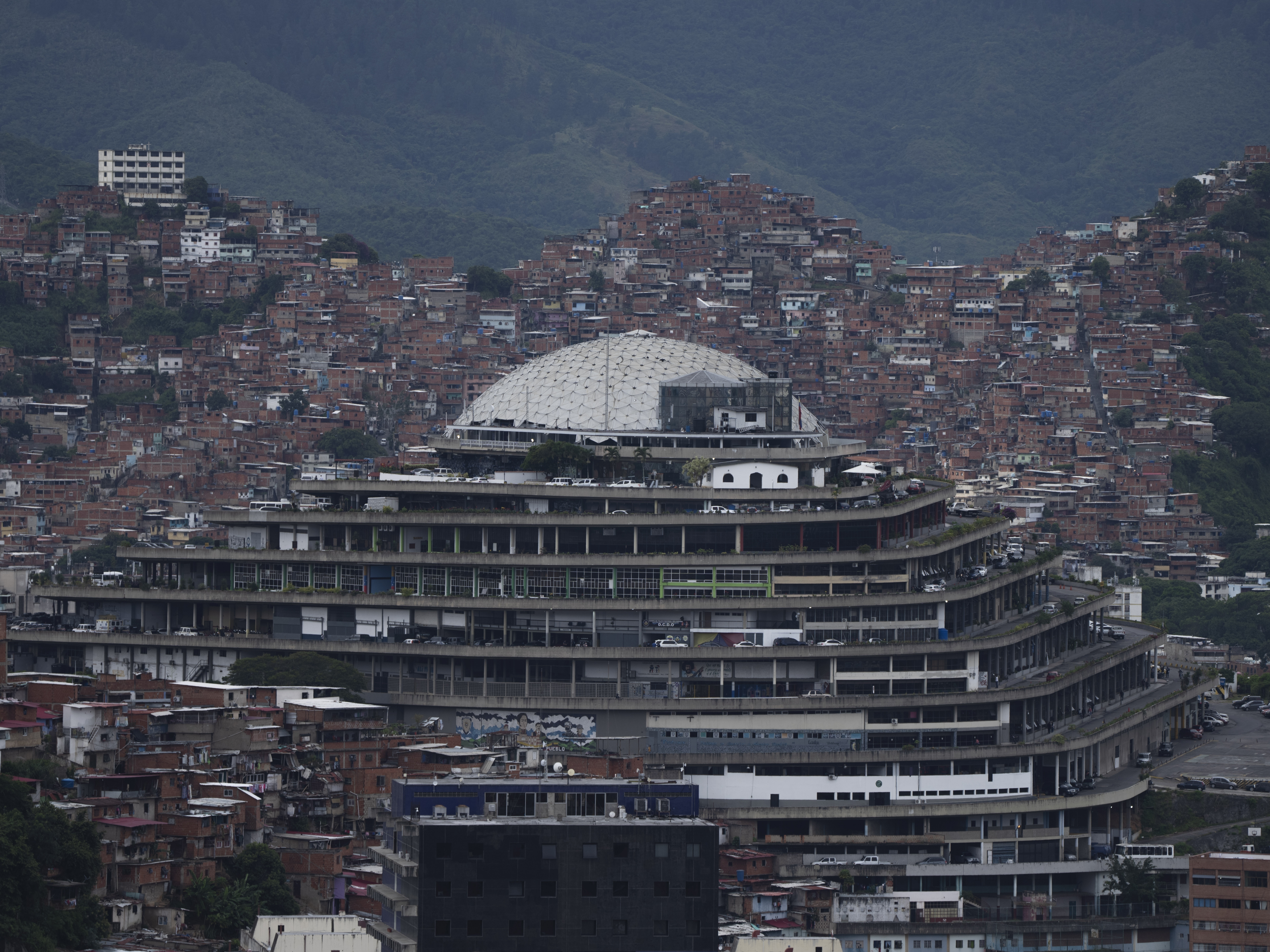 caption: Venezuela's National Intelligence Service headquarters, known as El Helicoide, stands in front of La Cota 905 neighborhood in Caracas, Venezuela, Sept. 12, 2022.