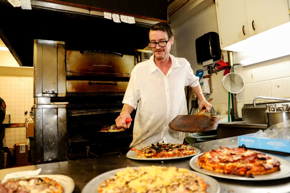 caption: Kevin Housluy has been making pizza at Northlake Tavern & Pizza House for more than 20 years. Jan. 31, 2023 was the Tavern's last day. 