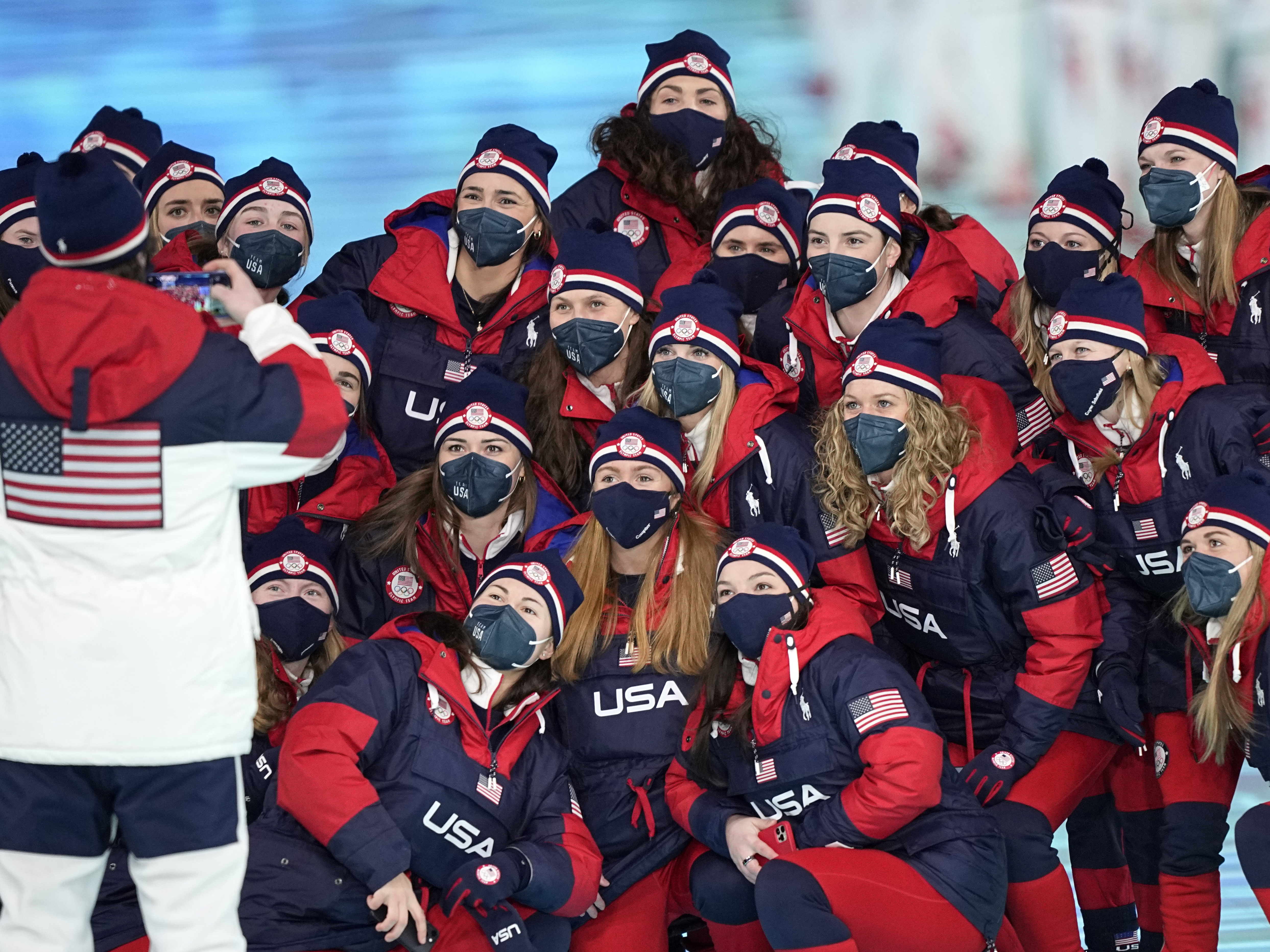 caption: The team from the United States arrives during the opening ceremony of the 2022 Winter Olympics, Friday, Feb. 4, 2022, in Beijing.