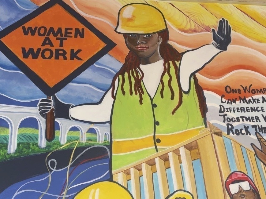 caption: A mural by artist Tene Smith is seen near the entrance of Chicago Women in Trades, a nonprofit dedicated to training and retaining women in the skilled construction trades is photographed April 1, 2025, at the facility in Chicago.