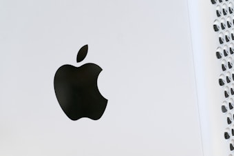 caption: This May 21, 2021 photo shows the Apple logo displayed on a Mac Pro desktop computer in New York. Apple is planning to scan U.S. iPhones for images of child abuse, drawing applause from child protection groups but raising concern among security researchers that the system could be misused by governments looking to surveil their citizens.