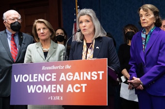 caption: Sen. Joni Ernst, R-Iowa, speaks alongside several other senators on Wednesday as they announce a bipartisan agreement to update the Violence Against Women Act.