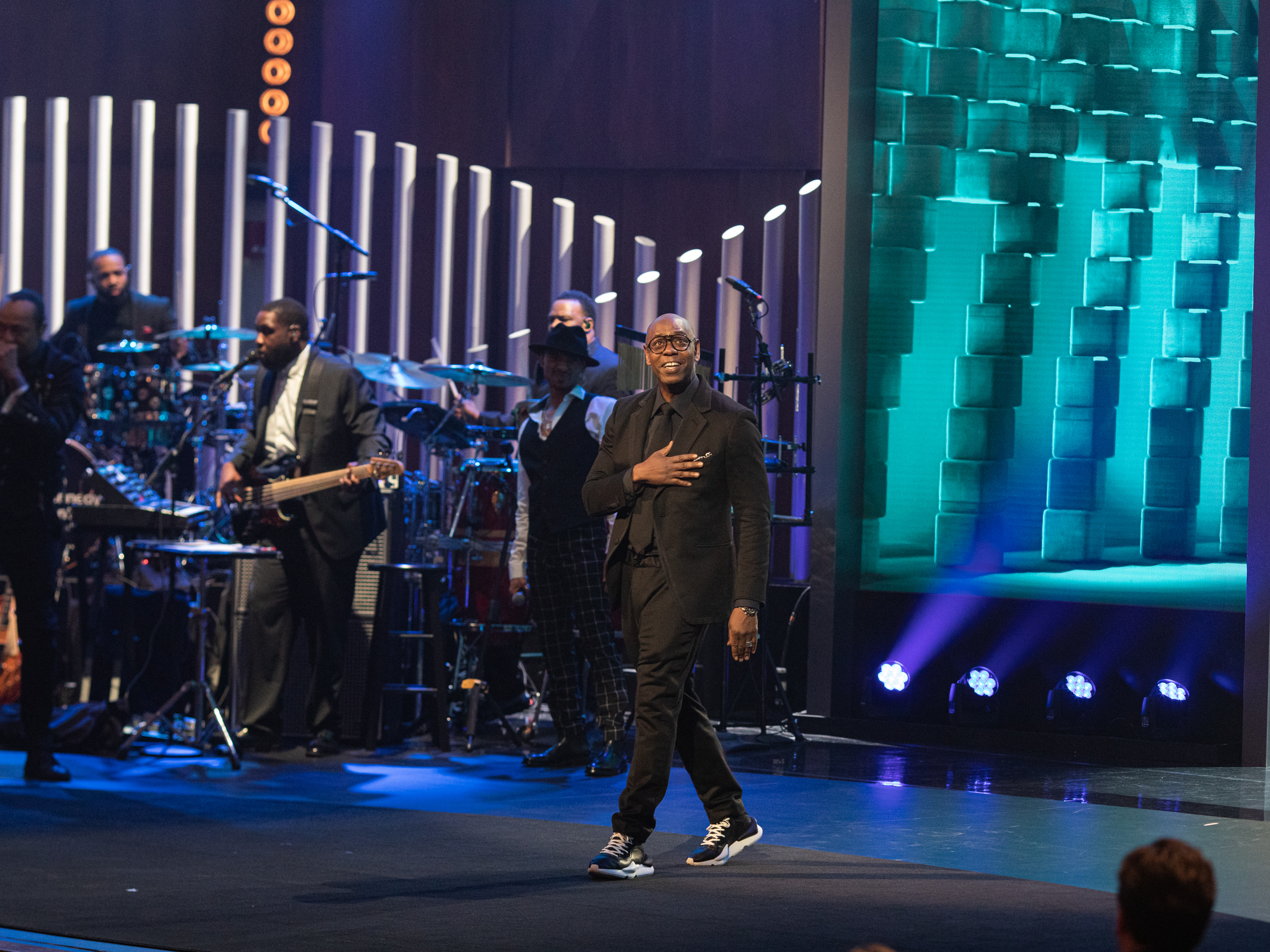 caption: Dave Chappelle accepts the Mark Twain Prize for American Humor at the John F. Kennedy Center for the Performing Arts. PBS will air a television special of the ceremony in January.