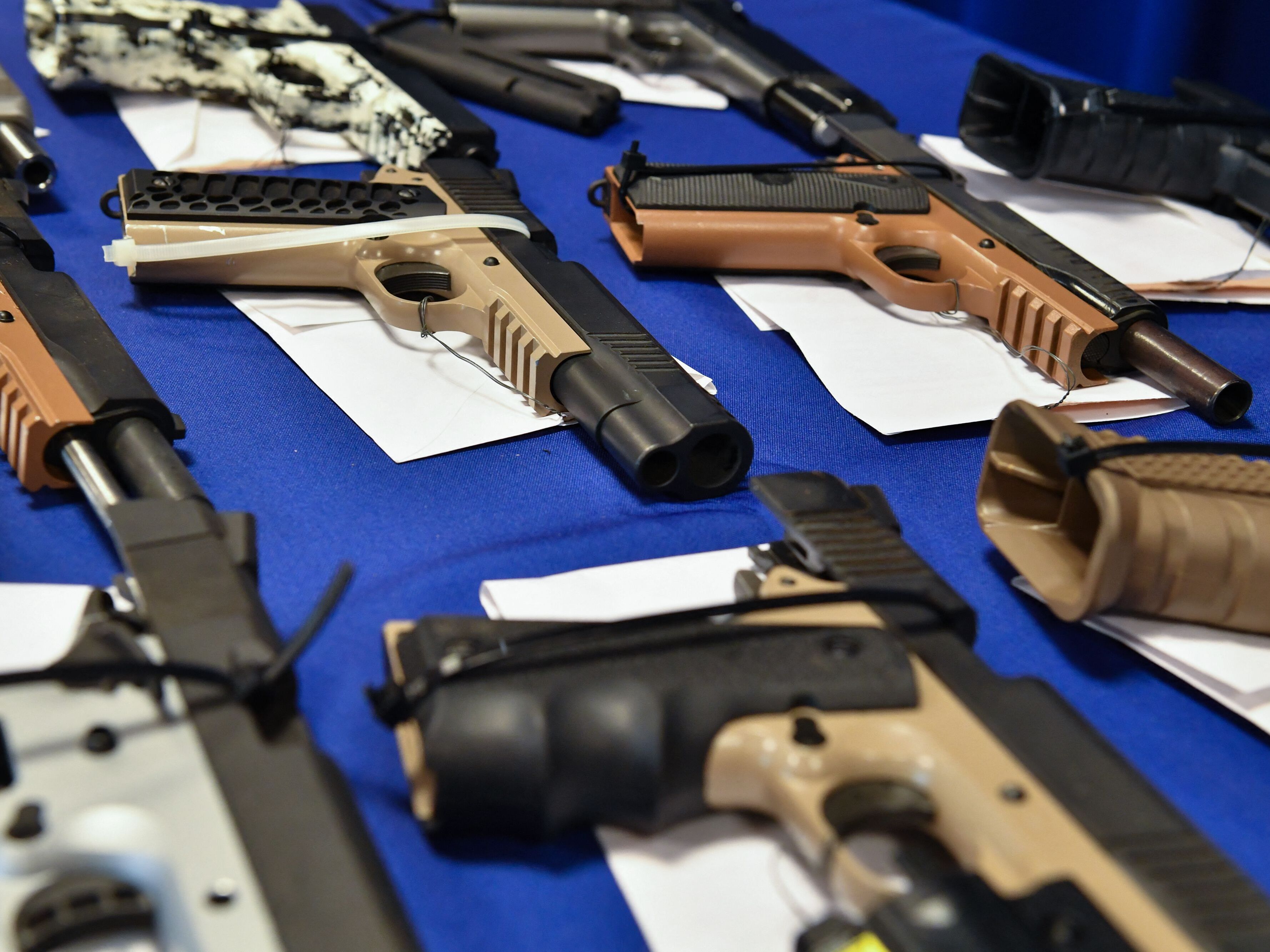caption: "Ghost guns" seized in federal law enforcement actions are displayed at the Bureau of Alcohol, Tobacco, Firearms and Explosives field office in Glendale, Calif., in April 2022.