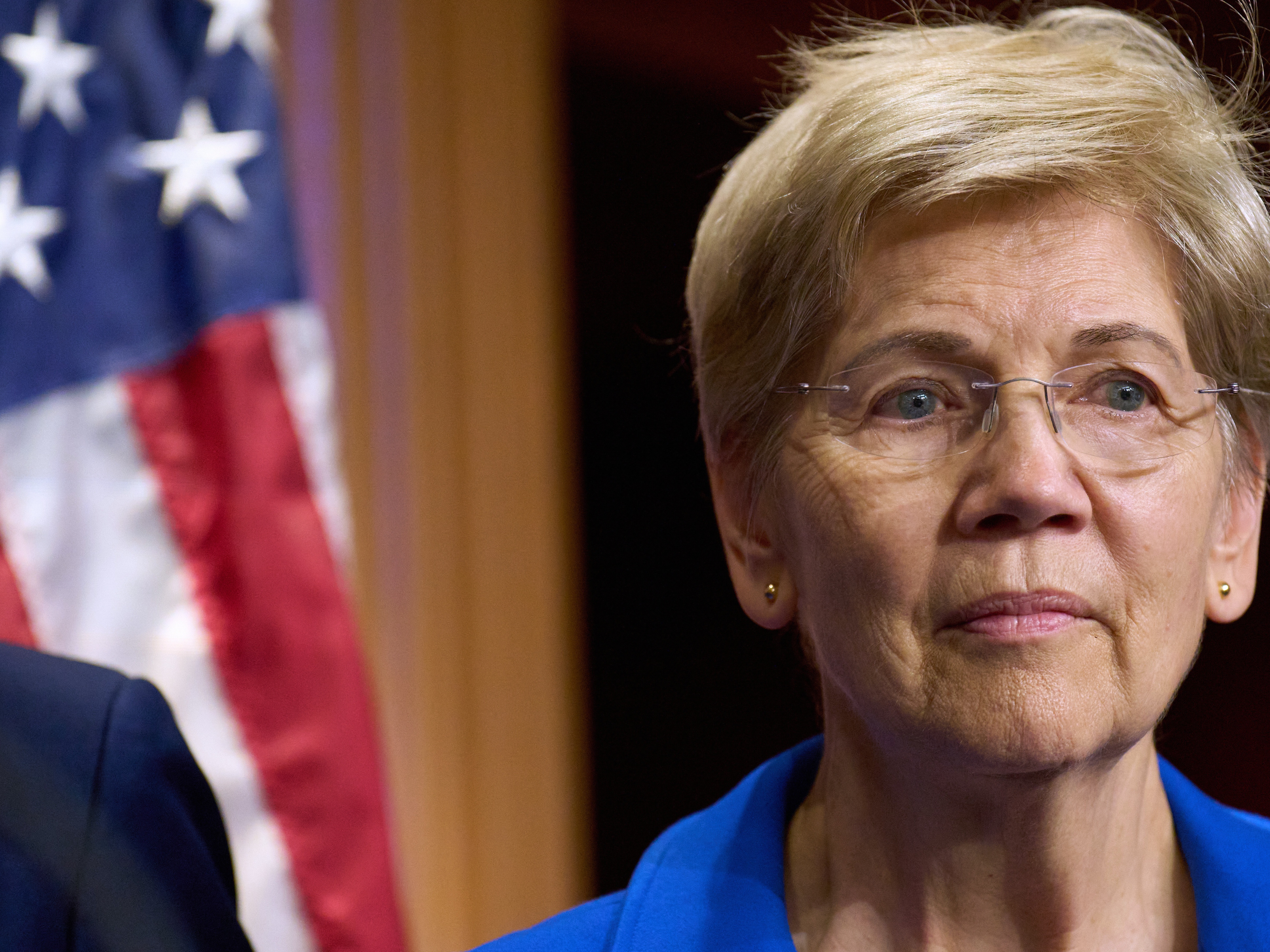 caption: Sen. Elizabeth Warren, D-Mass., attends a news conference about SNAP benefits on Oct. 29 on Capitol Hill in Washington.