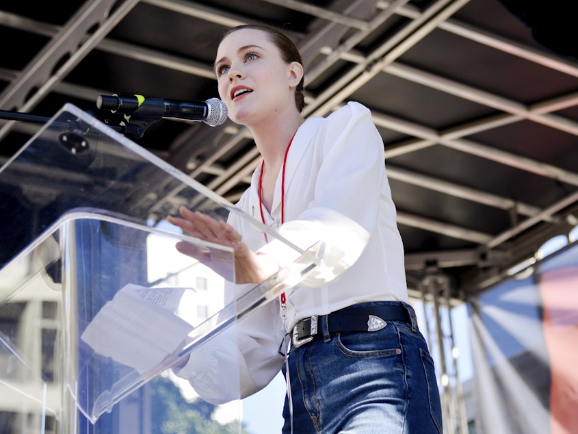 caption: Actress Evan Rachel Wood, speaking at the Women's March in Los Angeles in 2019.