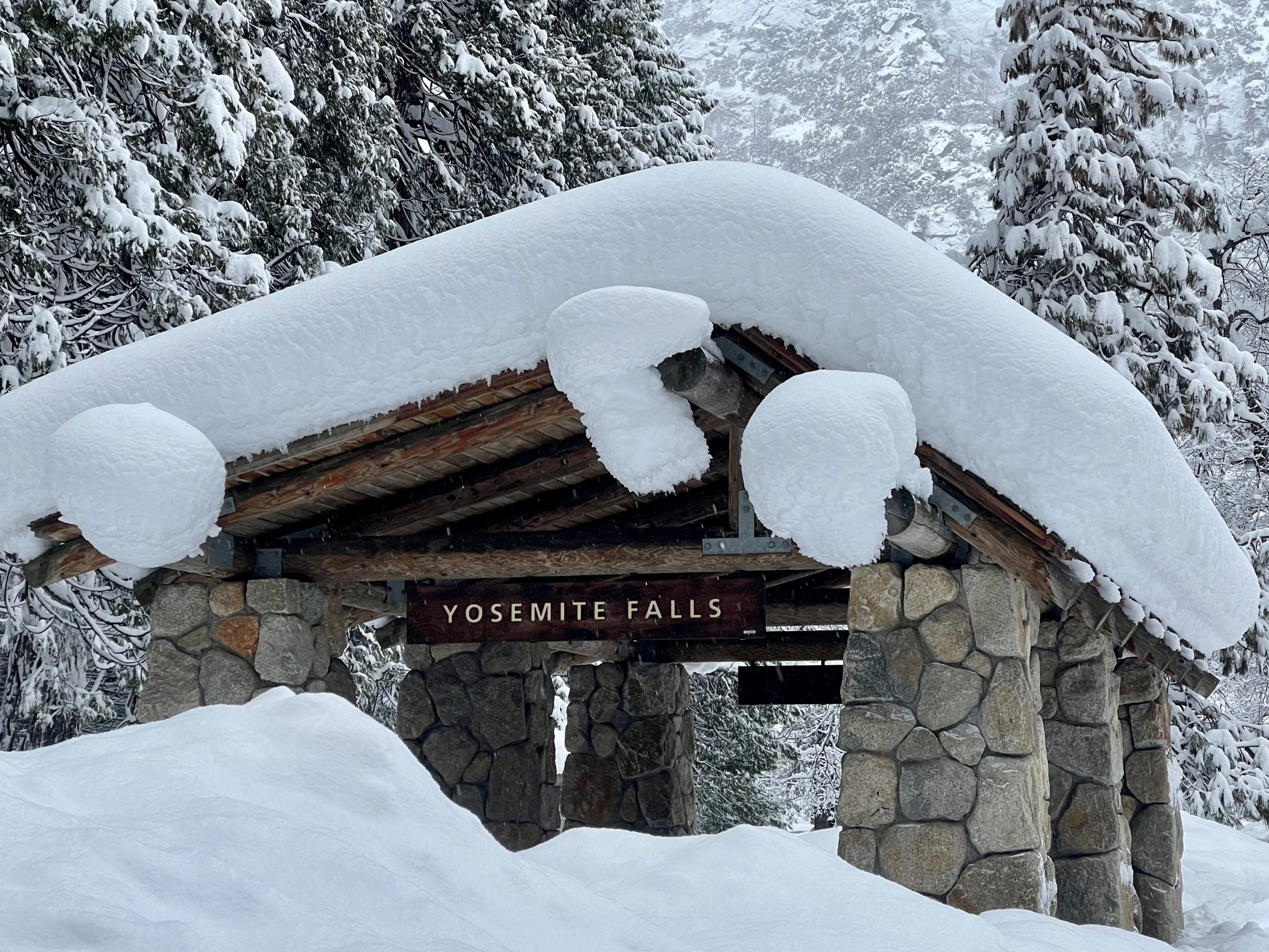 caption: In this photo provided by the National Park Service, a structure at Yosemite Falls in Yosemite National Park, Calif., is covered in snow on Feb. 28.