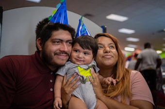 caption: Louie Villasana, who just turned 1, with dad, Luis Fernando Villasana, and mom, Samantha Casiano.