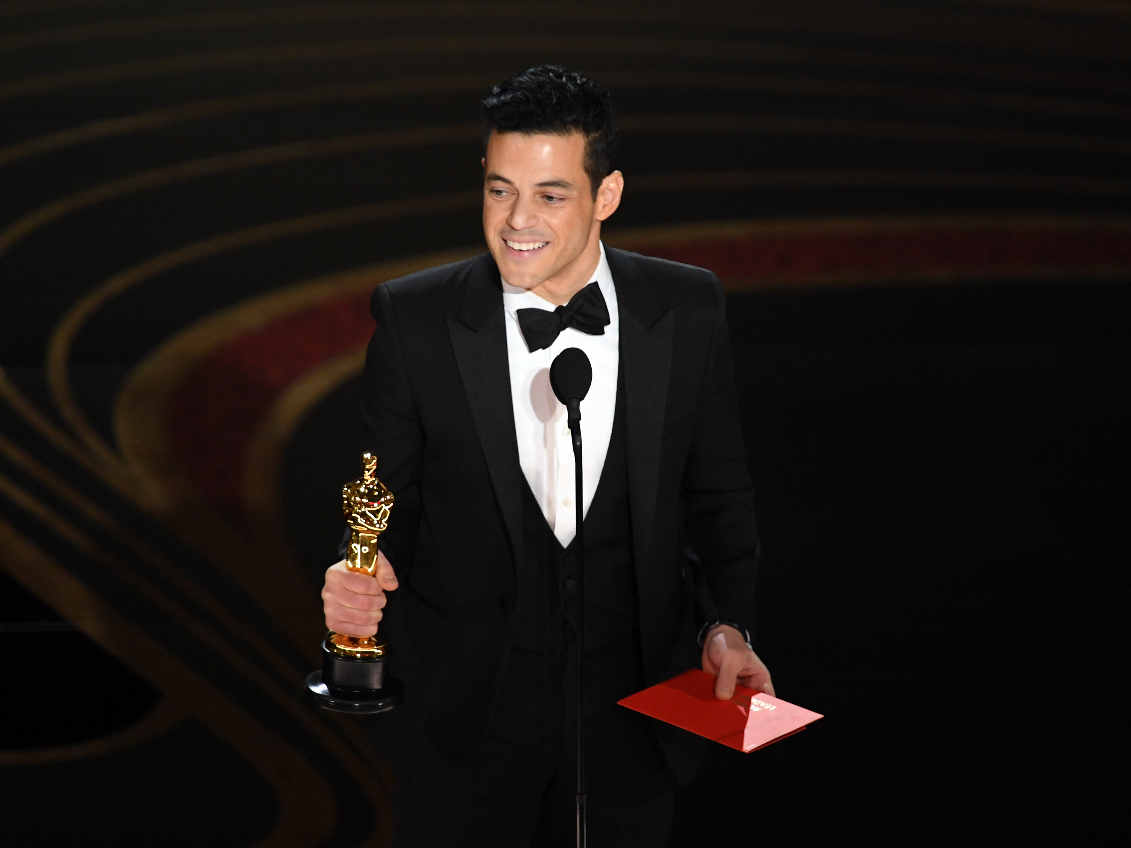caption: Rami Malek accepts the Academy Award for actor in a leading role for his performance in <em>Bohemian Rhapsody.</em>