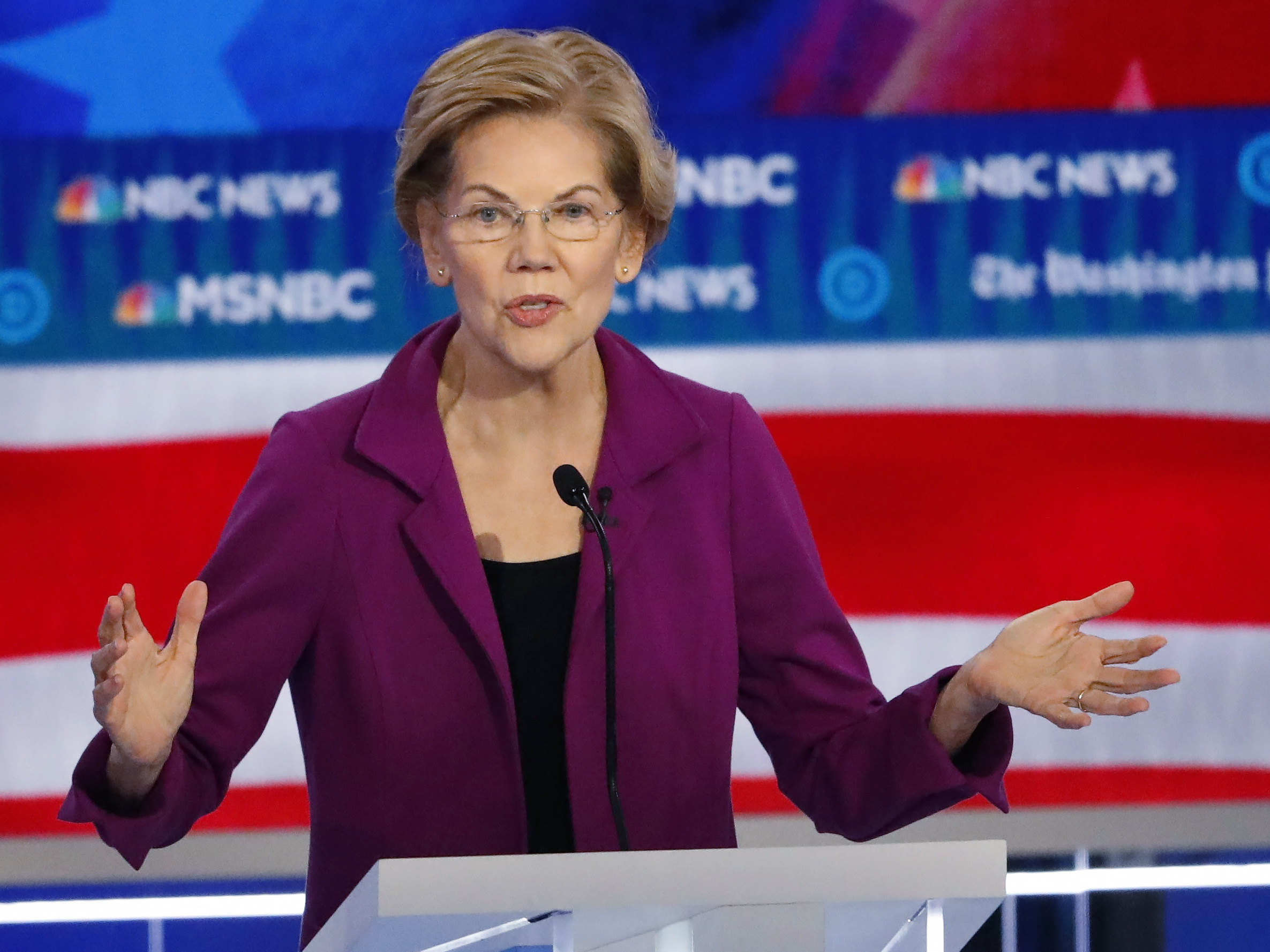 caption: In this Nov. 20, 2019, photo, Democratic presidential candidate Sen. Elizabeth Warren, D-Mass., speaks during a Democratic presidential primary debate in Atlanta. (AP Photo/John Bazemore)