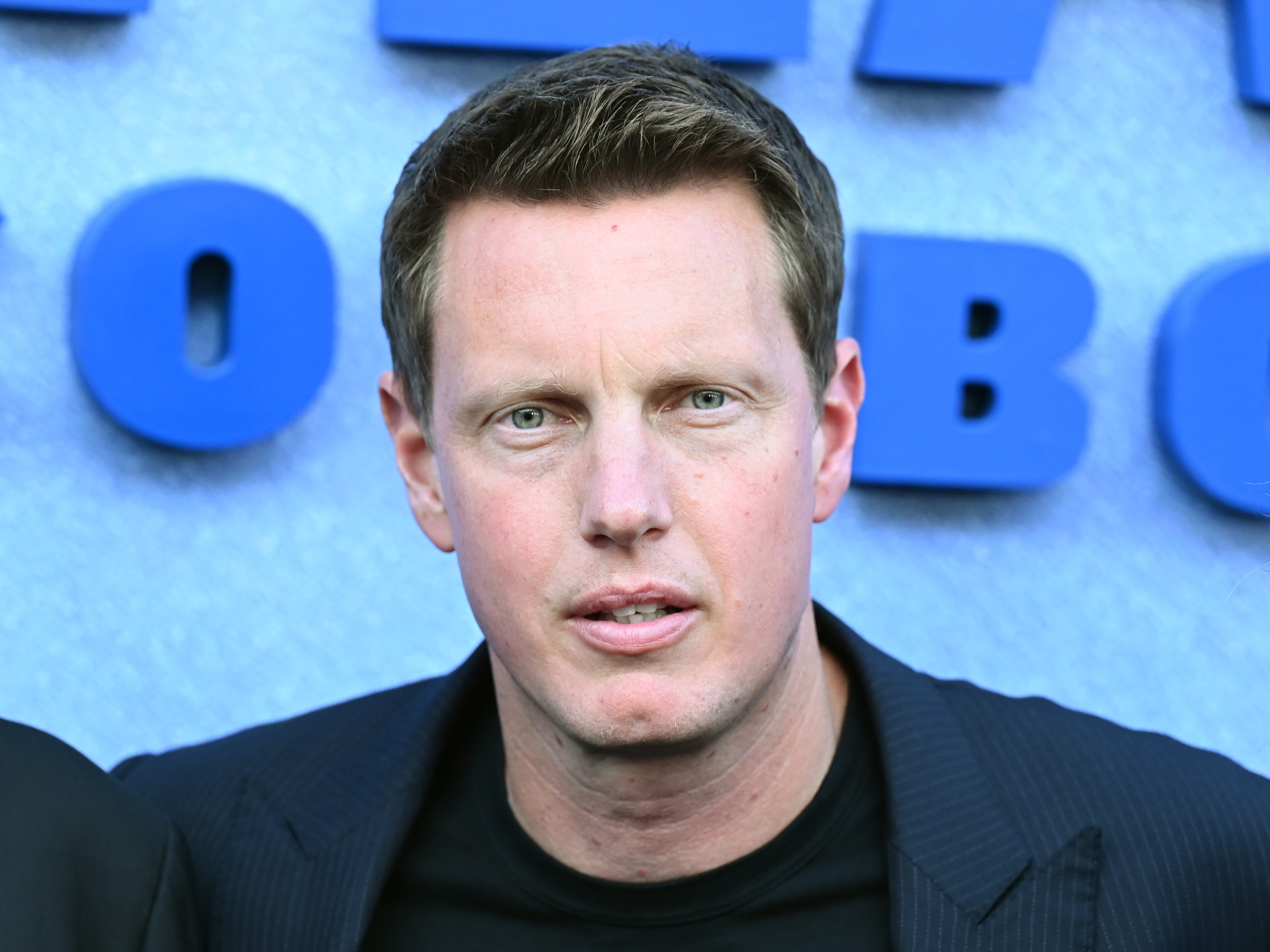 caption: Under new owner David Ellison, CBS parent company Paramount has taken several steps to appease concerns about bias from the Trump administration, including hiring a news ombudsman with strong conservative credentials.