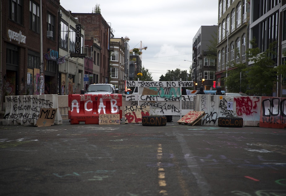 caption: A barricade is shown at the Capitol Hill Autonomous Zone, CHAZ, or Capitol Hill Occupied Protest, CHOP, on Saturday, June 13, 2020, in Seattle.