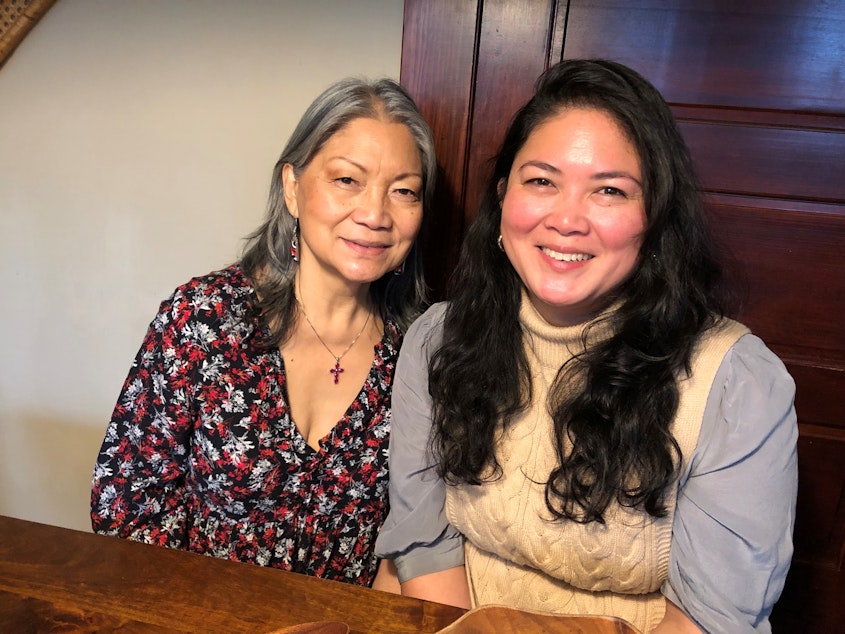 caption: Lucy Garcia, left, and daughter Jan Parker pose for a portrait in Tacoma, December 2021.