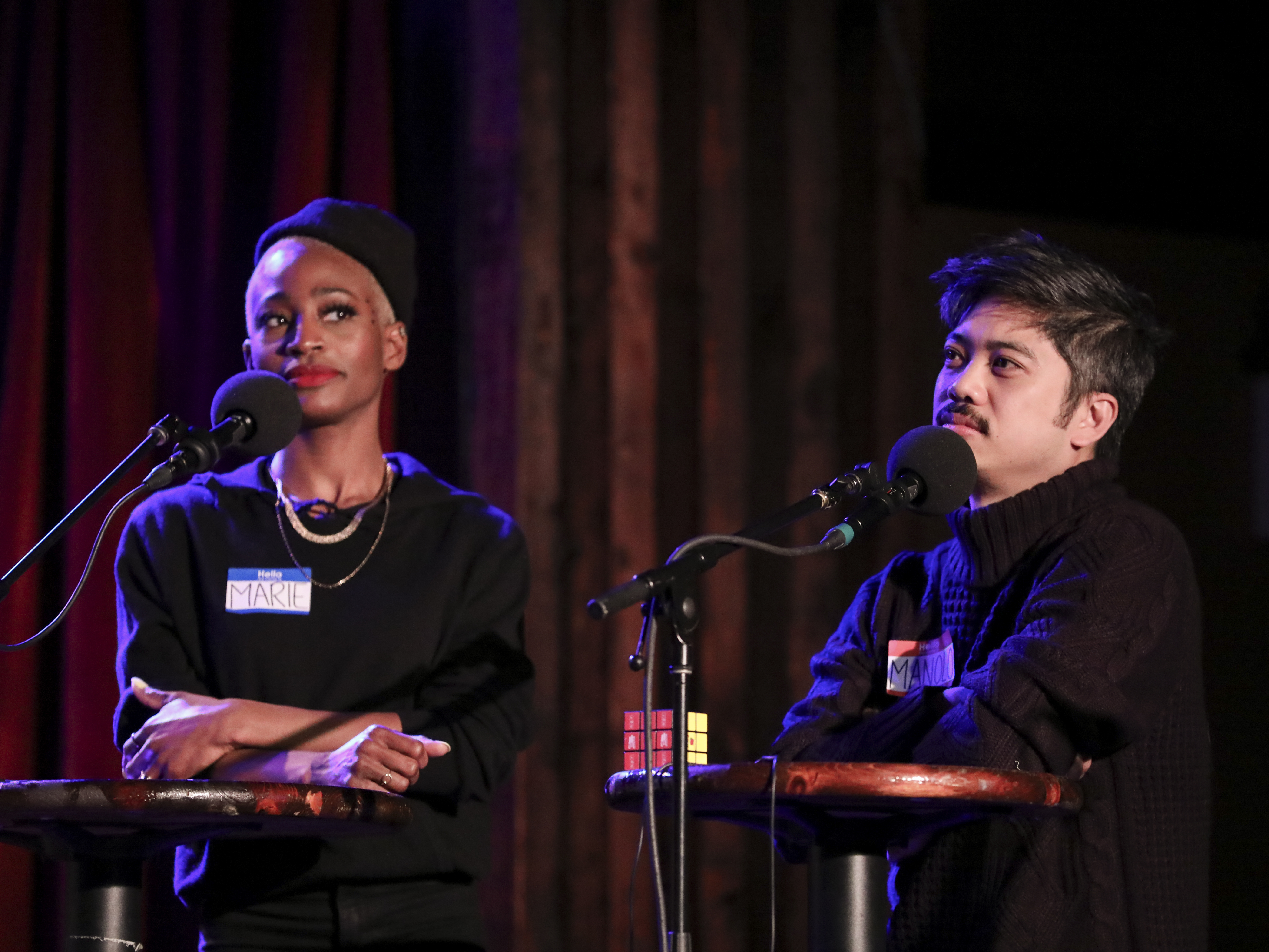 caption: Marie Faustin and Manolo Moreno go head-to-head in<em> Ask Me Another</em>'s final round at the Bell House in Brooklyn, New York.
