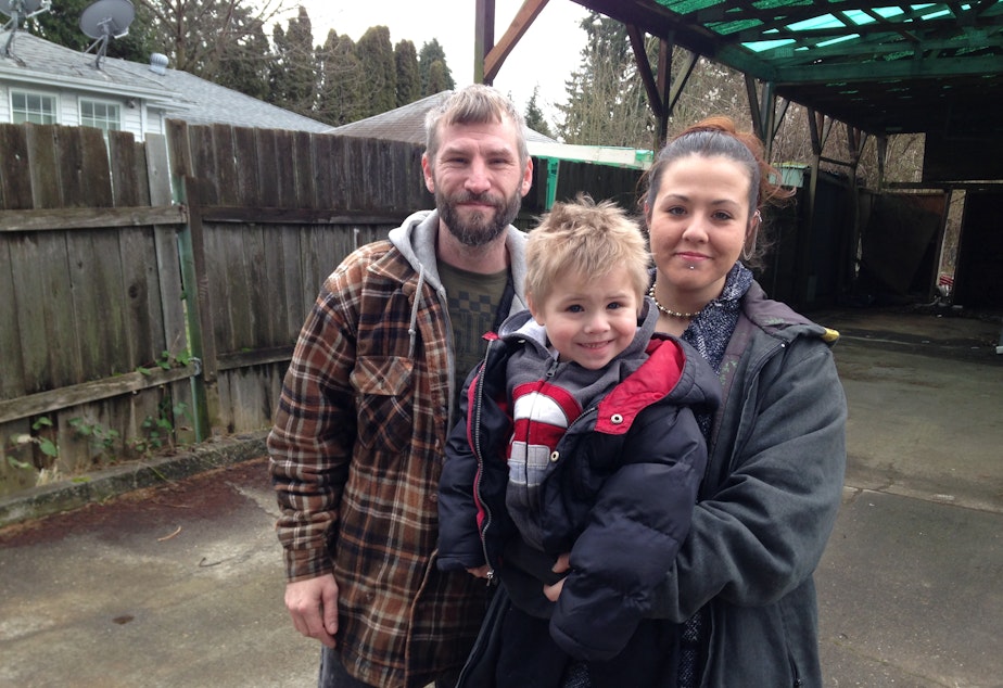 Larry Jametsky, Christina Stewart and their son Lawrence outside the home they say they lost in a fraudulent loan deal.