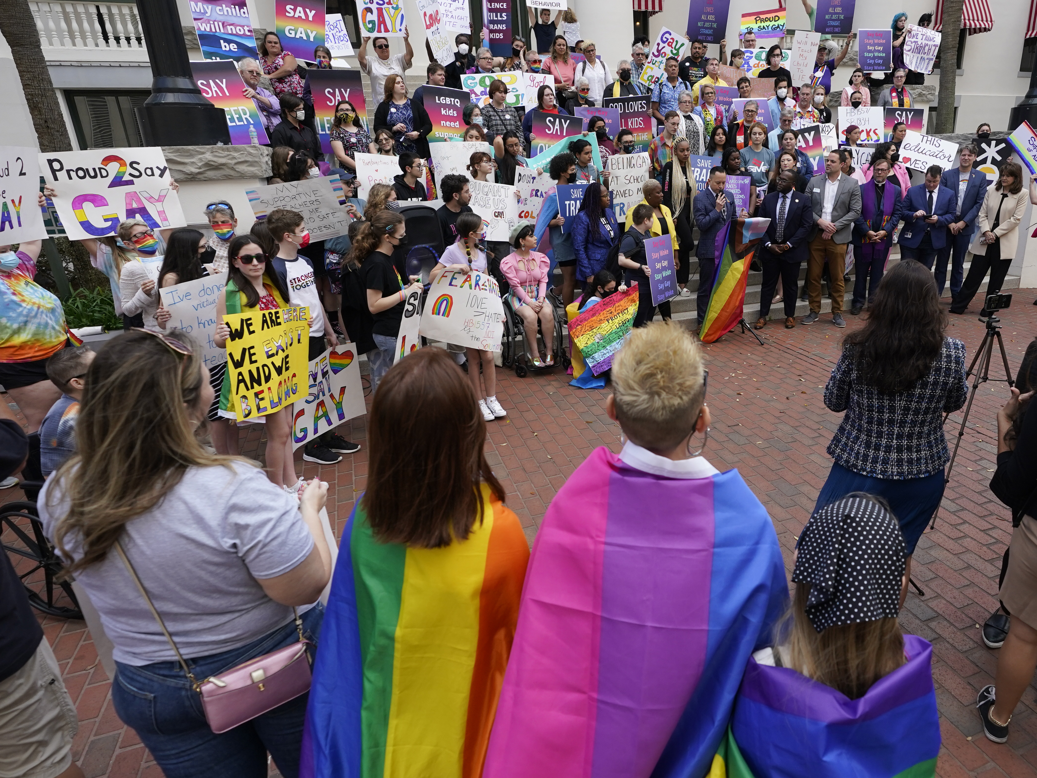 caption: Demonstrators gather on the steps of the Florida Historic Capitol Museum in front of the Florida State Capitol, March 7, 2022, in Tallahassee, Florida