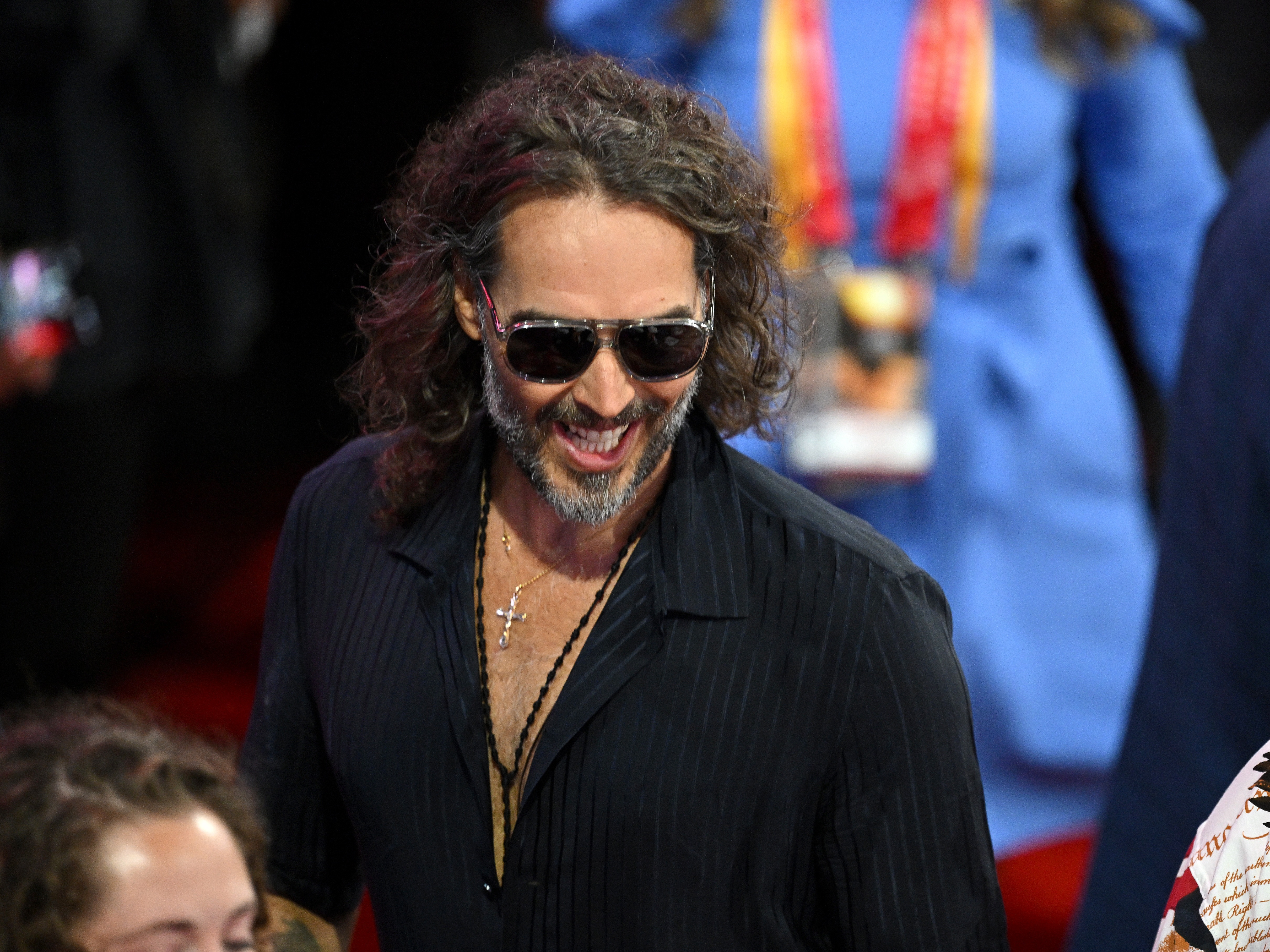 caption: Comedian and actor Russell Brand is facing criminal charges in England over rape and sexual assault allegations that span some six years. He's seen here attending the Republican National Convention in July.
