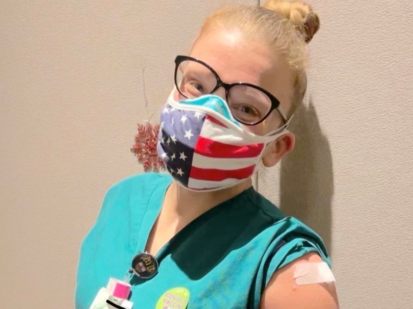 caption: Lydia Mobley, an ICU nurse pictured on Dec. 18, 2020, when she received her first dose of a coronavirus vaccine, says her hospital in central Michigan is "seeing more COVID patients, which means more people dying."