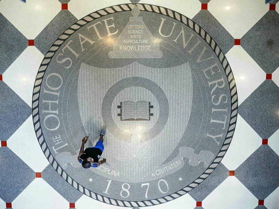 caption: Pedestrians pass through The Ohio State University's student union.
