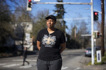 caption: Joy Hollingsworth at the intersection of 23rd Avenue East and East John Street, where her grandparents bought a house around 70 years ago.