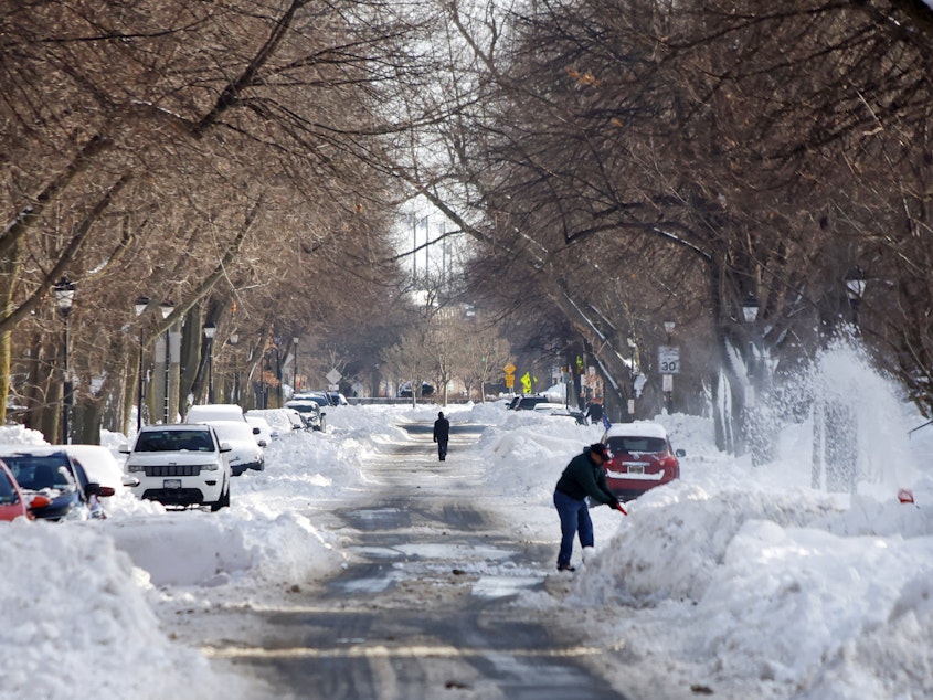 caption: Buffalo, N.Y., residents dig out after a historic and catastrophic blizzard.