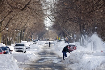 caption: Buffalo, N.Y., residents dig out after a historic and catastrophic blizzard.