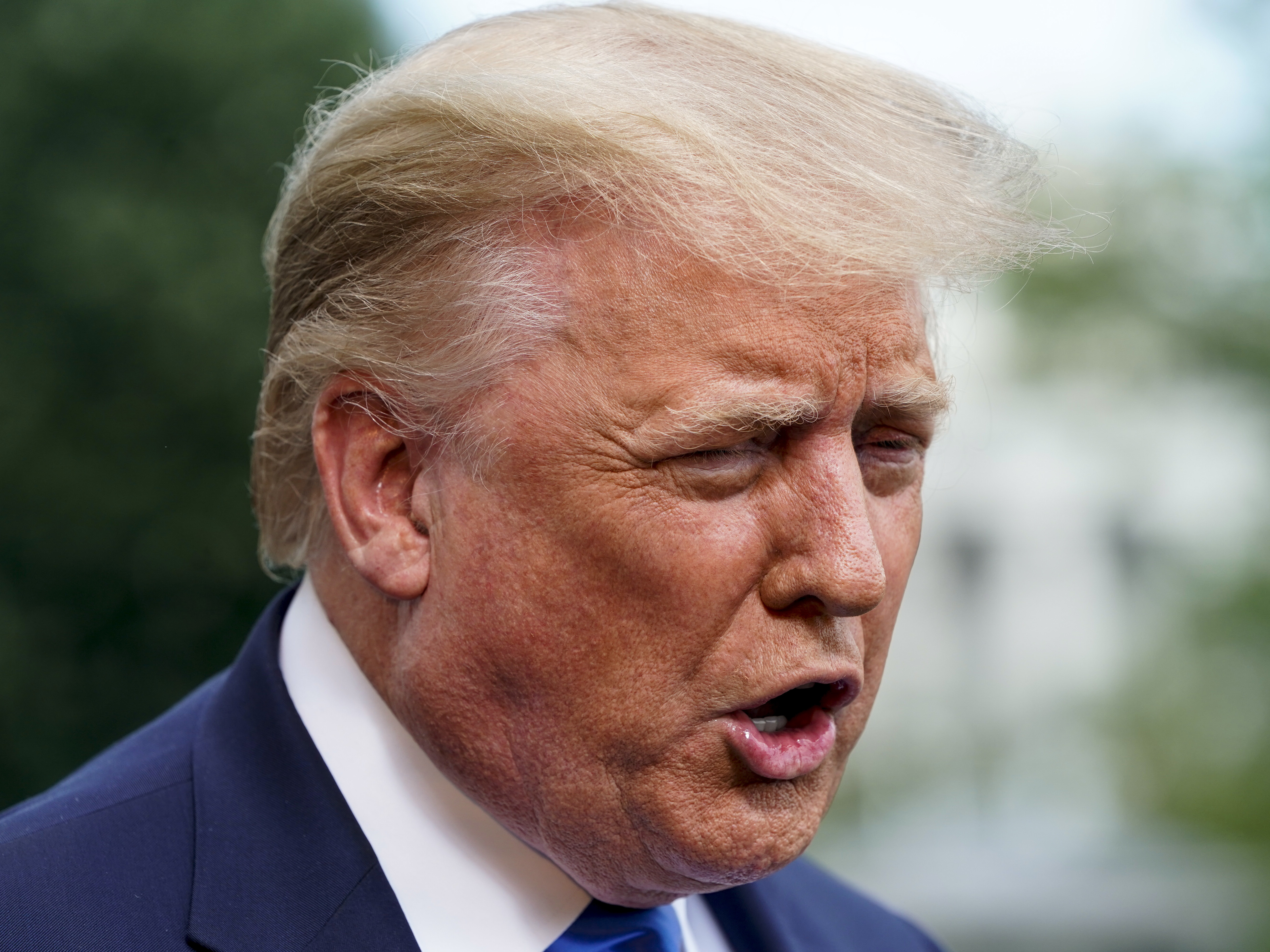 caption: President Trump spoke to the media last week at Walter Reed Medical Center.