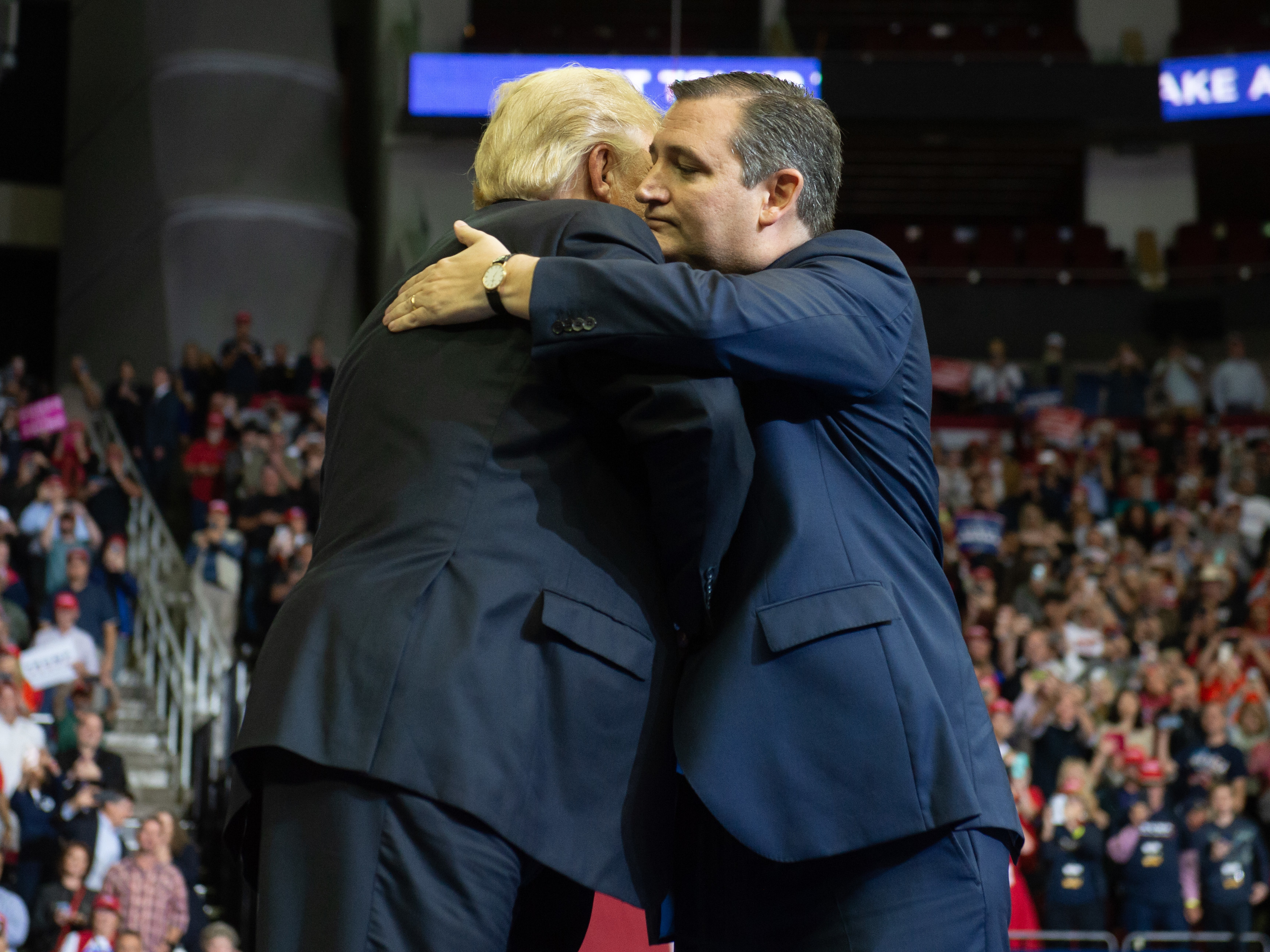 caption: President Trump embraces Sen. Ted Cruz during a campaign rally at the Toyota Center in Houston, Texas, Monday.