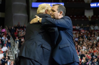 caption: President Trump embraces Sen. Ted Cruz during a campaign rally at the Toyota Center in Houston, Texas, Monday.