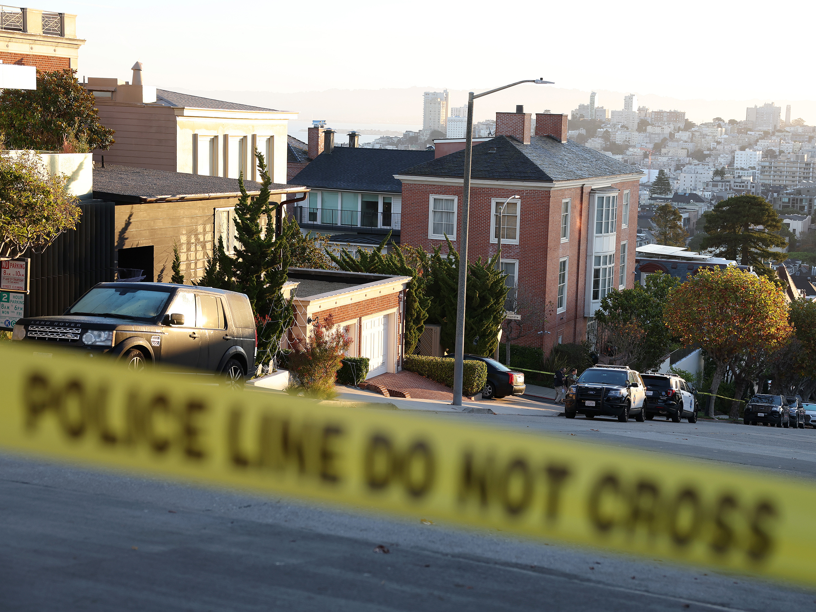 caption: Police tape is seen in front of the home of House Speaker Nancy Pelosi and her husband, Paul Pelosi, on Friday in San Francisco. Paul Pelosi was violently attacked in their home by an intruder.