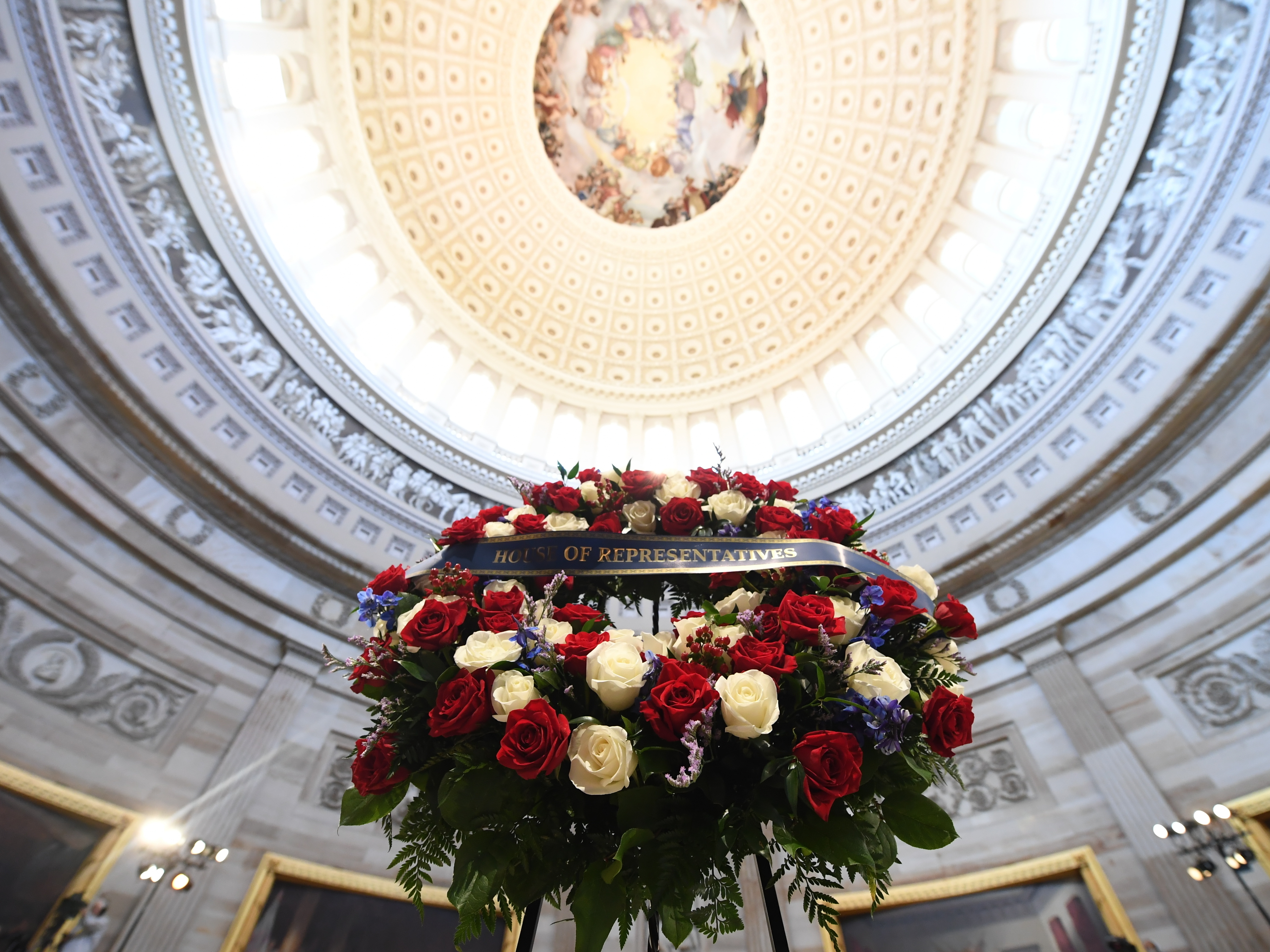 caption: A wreath is shown before the start of a memorial service Monday for U.S. Rep. John Lewis, D- Ga., in the Capitol Rotunda in Washington, D.C.