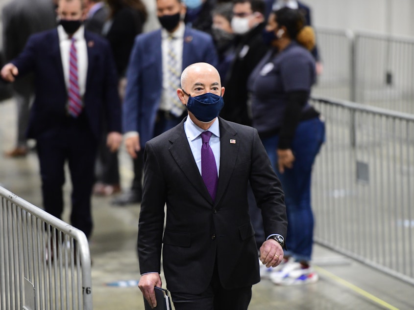 caption: U.S. Secretary of Homeland Security Alejandro Mayorkas, seen here on March 2 at a FEMA community vaccination center in Philadelphia, announced Saturday the agency will assist with the influx of migrant children at the U.S. southern border.