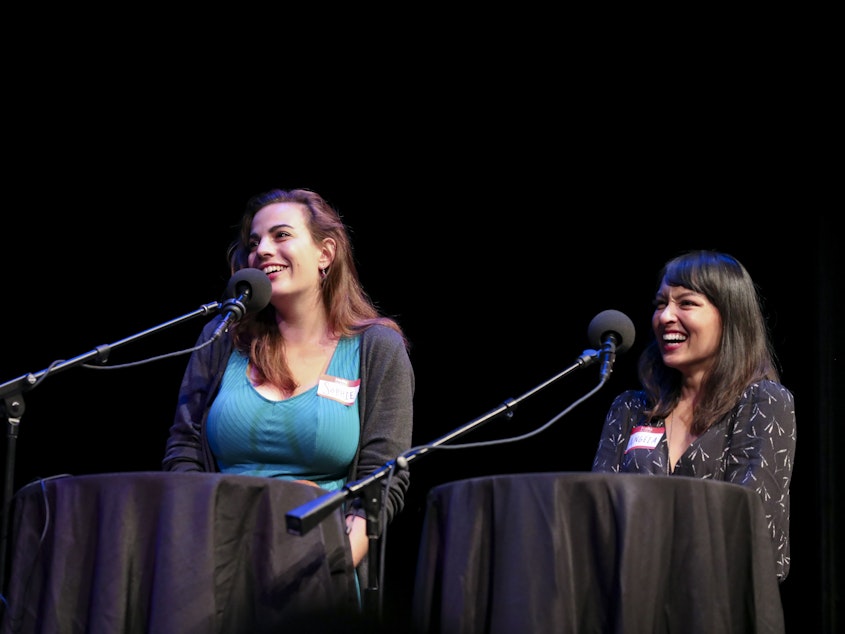 caption: Contestants Sophie Wasserman and Angela Estes compete in trivia games on <em>Ask Me Another</em> at the Balboa Theatre in San Diego, California
