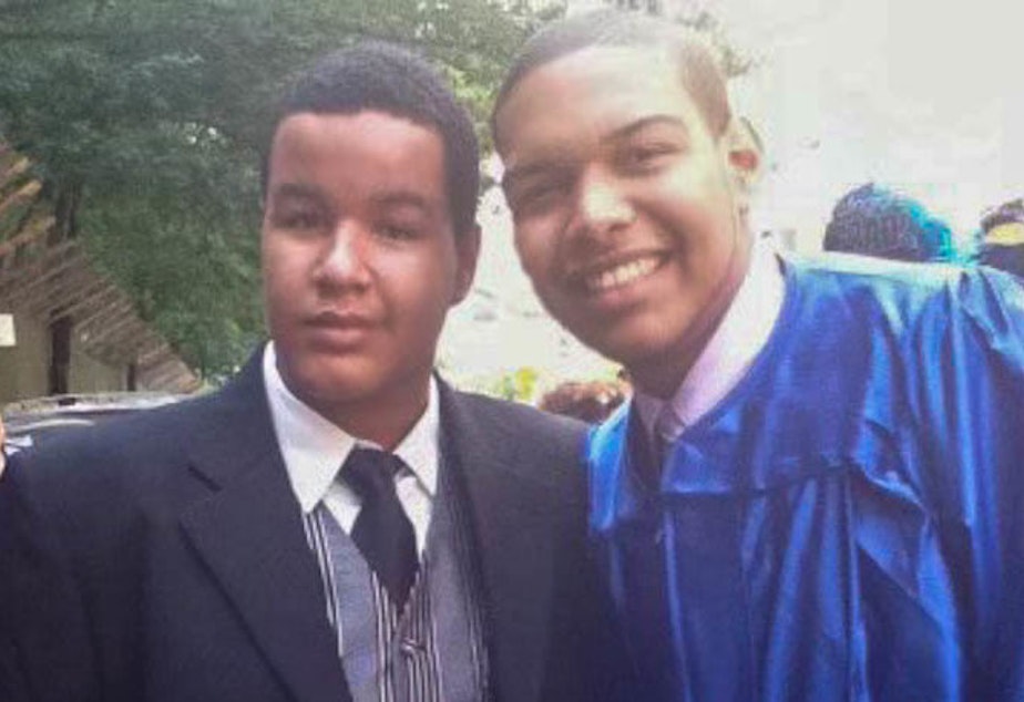 caption: Left to right: Angel Gonzalez and Luis Paulino are seen at Paulino's 2011 high school graduation in New York.