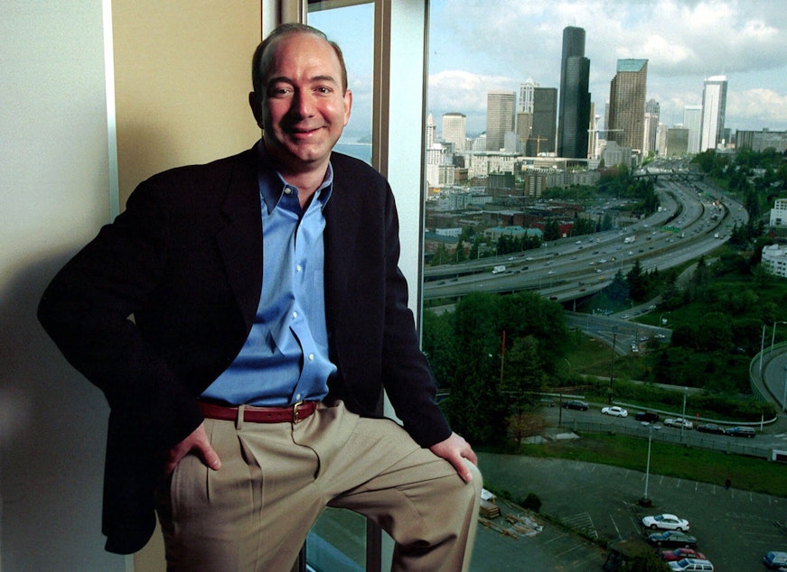caption: FILE: Jeff Bezos, founder and CEO of Amazon.com, is shown at the online retail company's offices overlooking the Seattle skyline on May 2, 2001. 