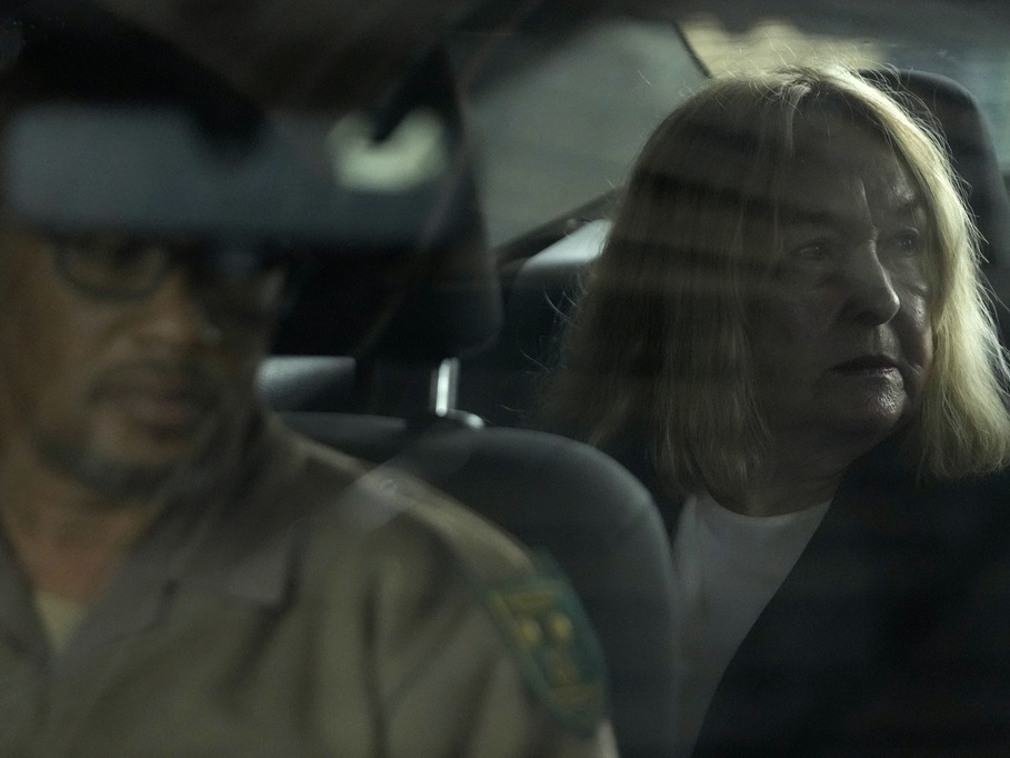 caption: June Steenkamp, the mother of Reeva Steenkamp sits inside the correctional service car Thursday at the Atteridgeville Prison for the parole hearing of Oscar Pistorius in Pretoria, South Africa.
