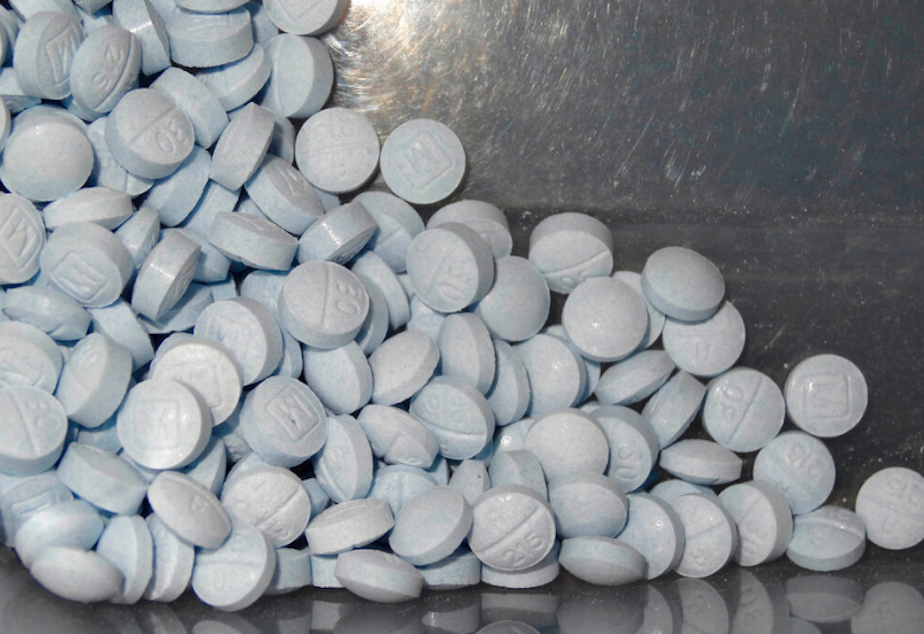 caption: A photo from the U.S. Attorneys Office for Utah shows fentanyl-laced fake oxycodone pills collected during an investigation. The drugs are generally foreign-made with a very close chemical makeup to the dangerous opioid. 